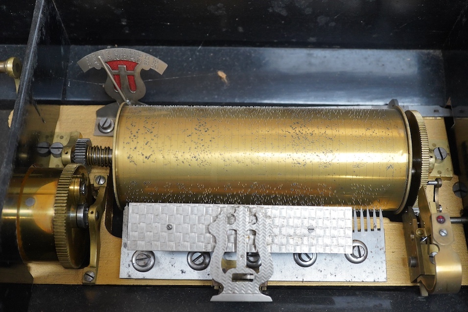 A 19th century Swiss cylinder music box, 58cm wide. Condition - fair to good, considerable wear to case